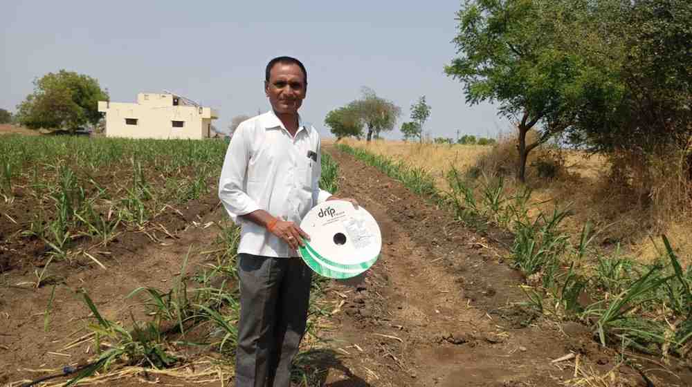 Farmer with Rain Pipe